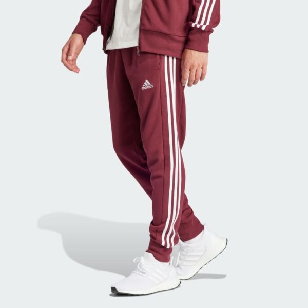 شلوار قرمز، سفید آدیداس مدل ESSENTIALS FRENCH TERRY TAPERED CUFF 3-STRIPES JOGGERS