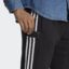 شلوار مشکی، سفید آدیداس مدل ESSENTIALS FRENCH TERRY TAPERED CUFF 3-STRIPES JOGGERS